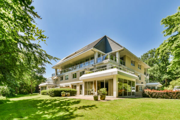 Unique custom built home with a sloped yard